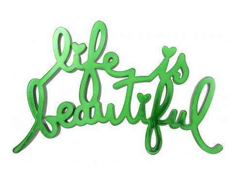 A green piece of metal reading "life is beautiful"